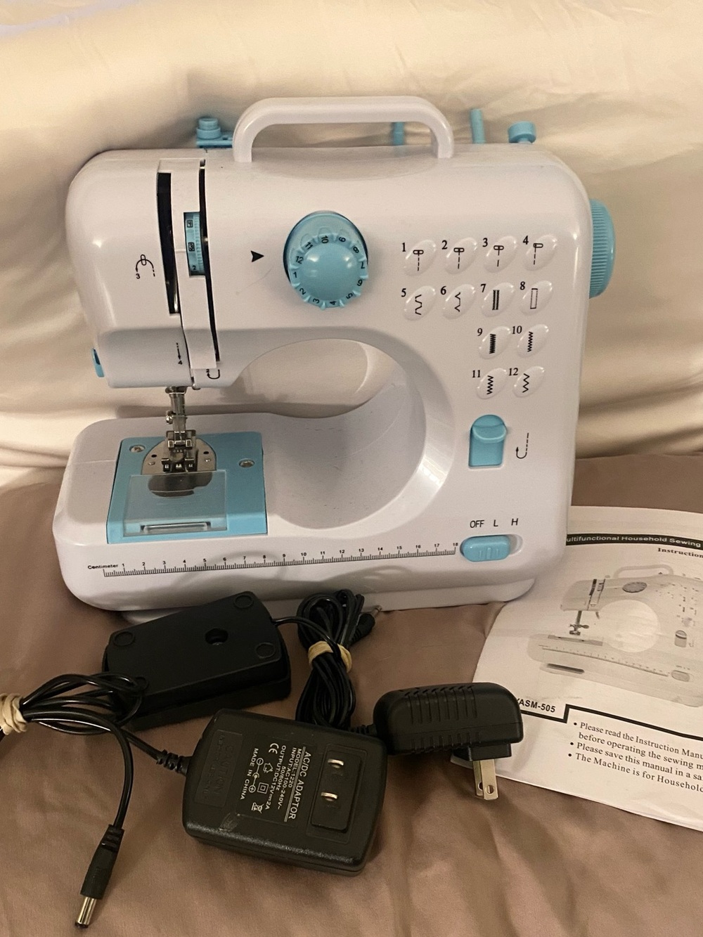 Compact White and Light Blue Portable Sewing Machine